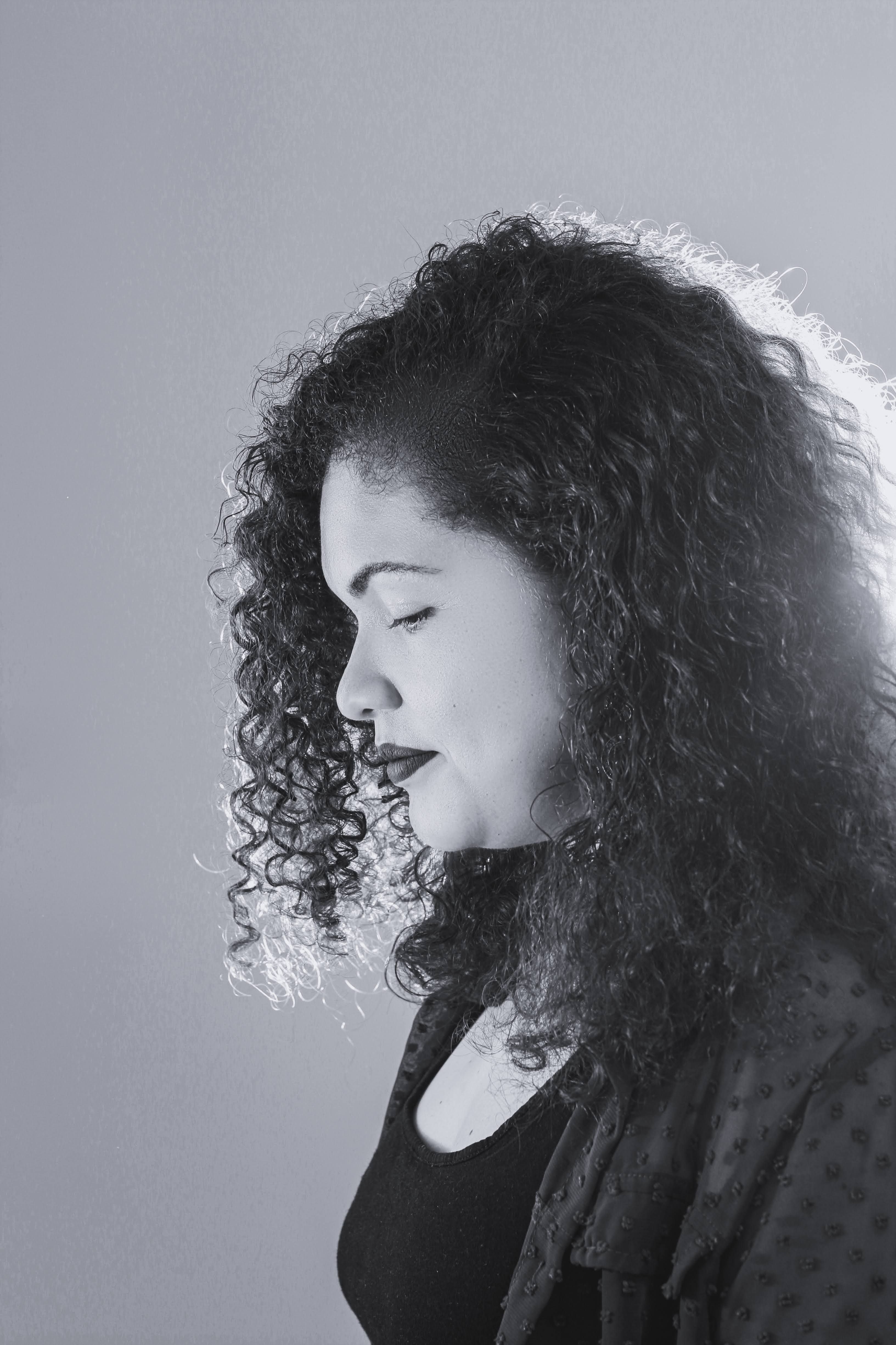 Black and White Photo of Woman with Curly Hair · Free Stock Photo
