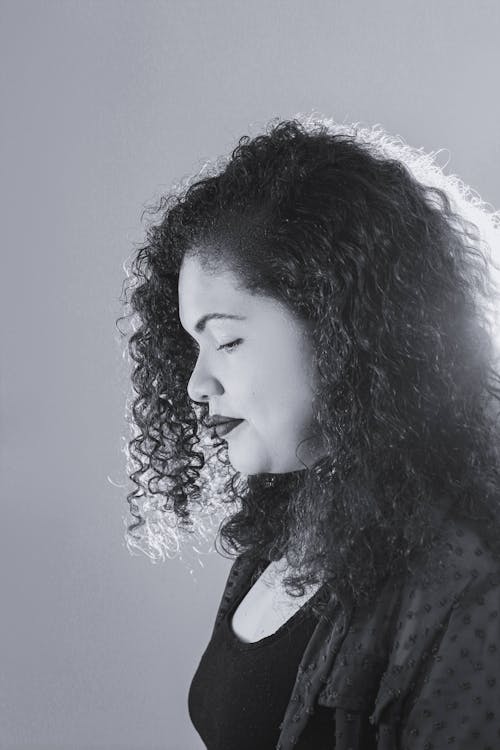 Free Black and White Photo of Woman with Curly Hair Stock Photo