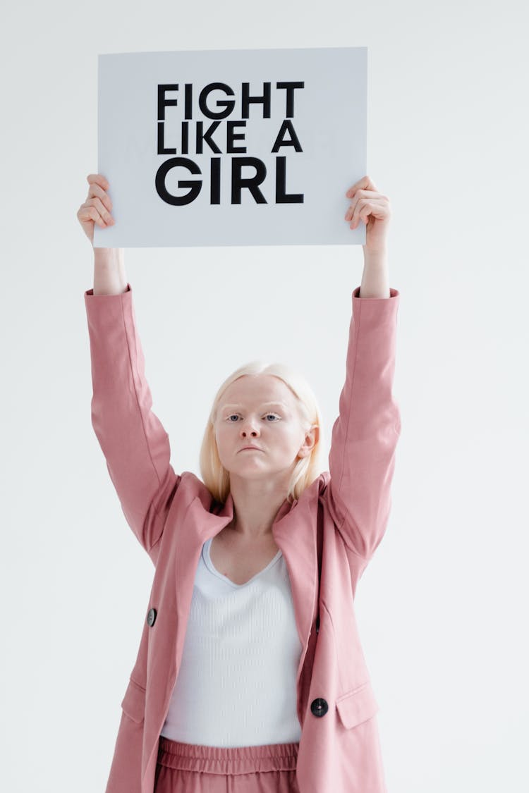 A Woman Holding A Placard