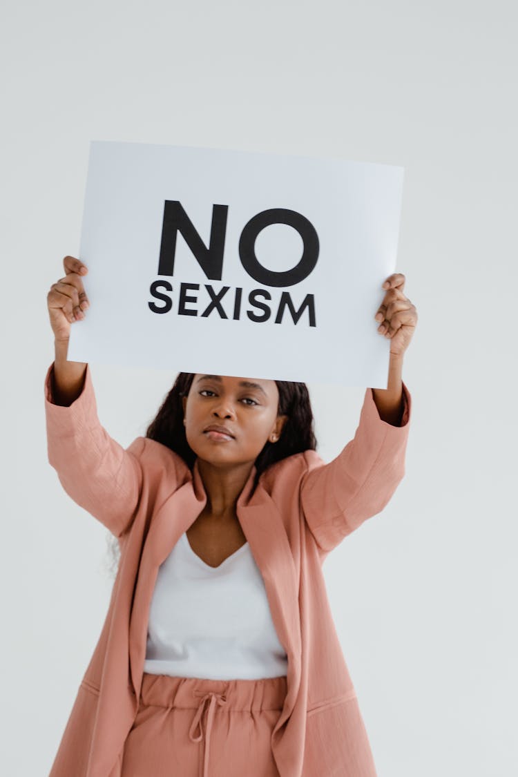 A Woman Holding An Equality Poster