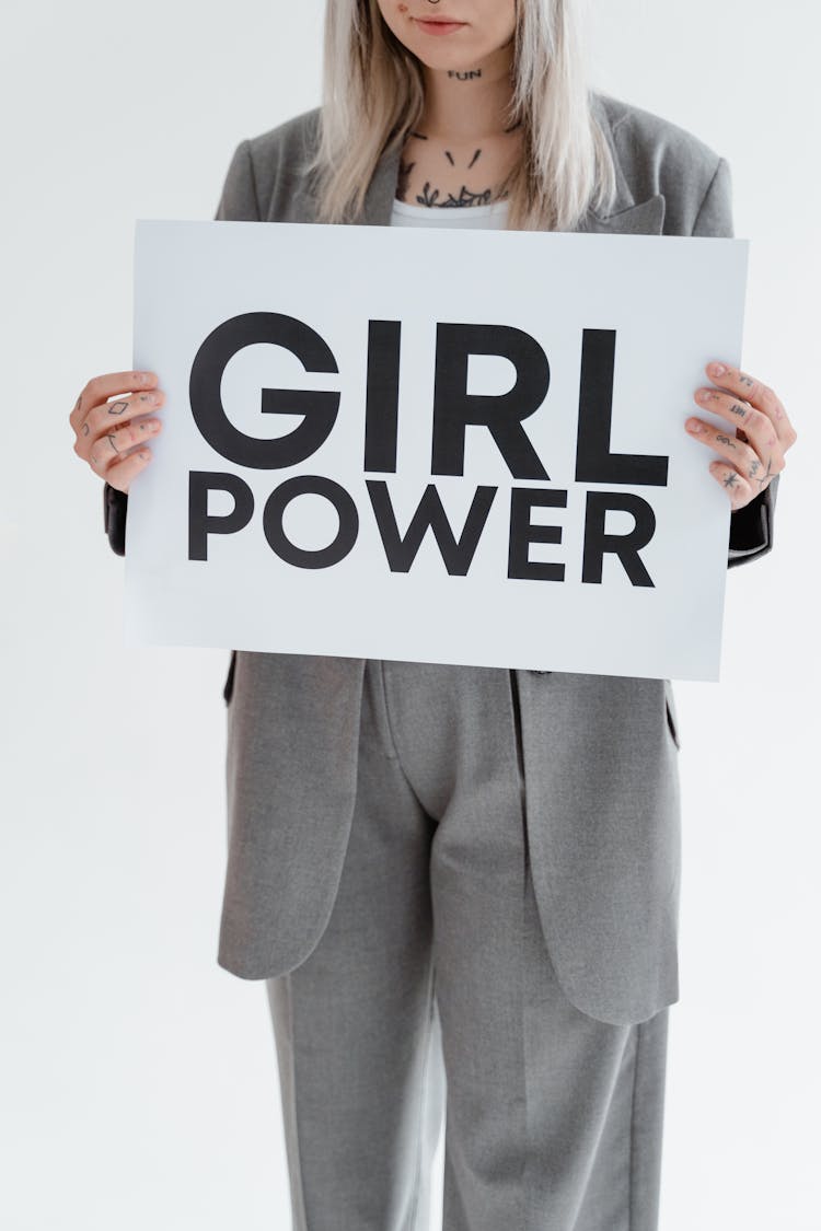 A Woman Holding A Placard