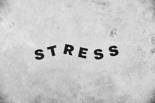 Backdrop of Stress inscription on rough wall