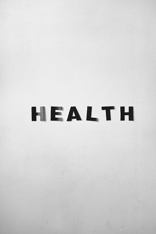 Black and white background of Health title on light gray wall with smooth surface