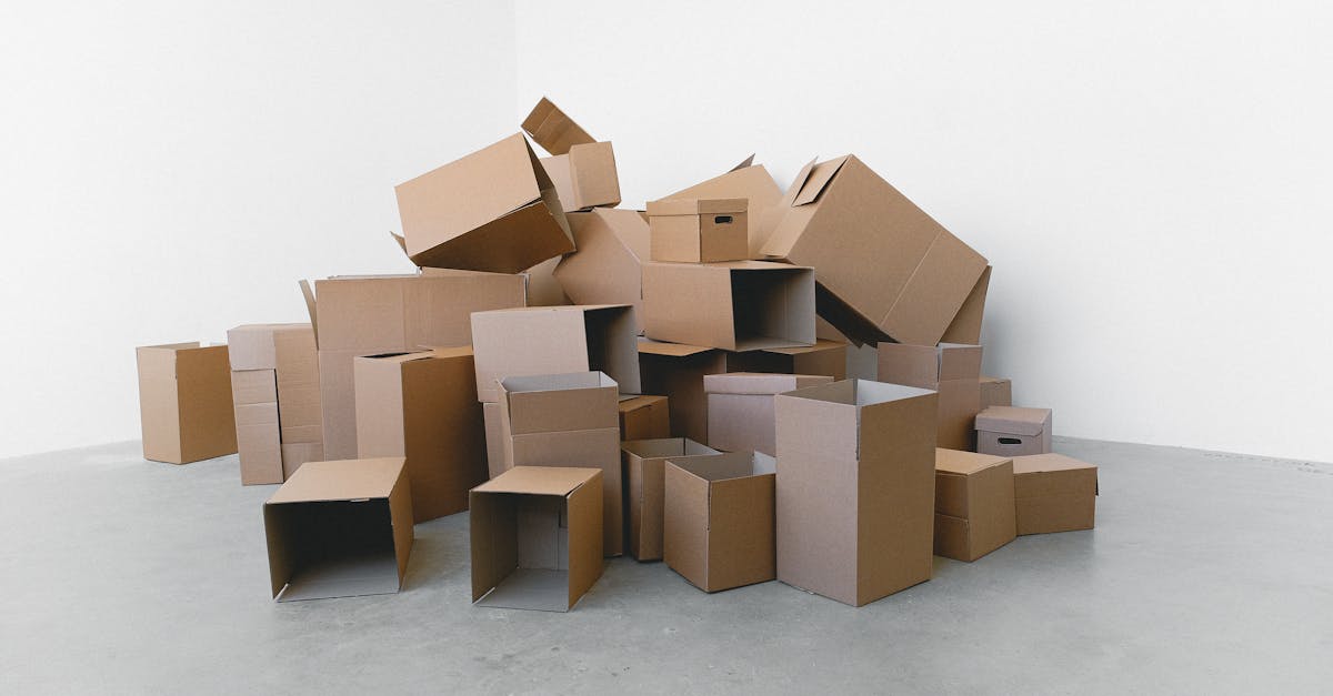 Stack of carton boxes on floor in rented house