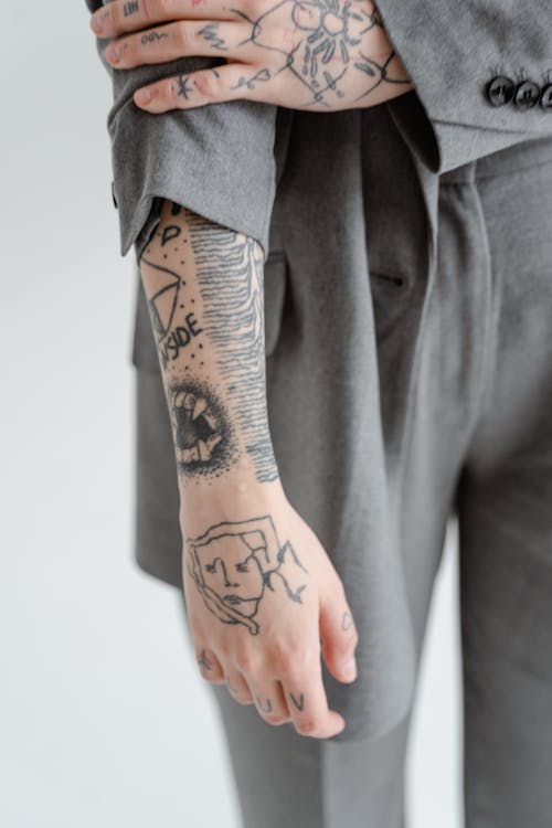 A Person with a Tattooed Arm