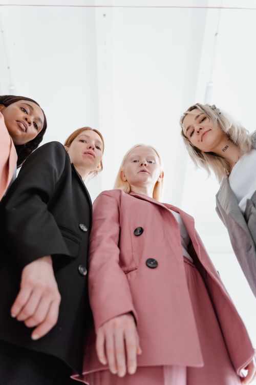 Free A diverse group of women in business suits standing confidently in a studio setting. Stock Photo