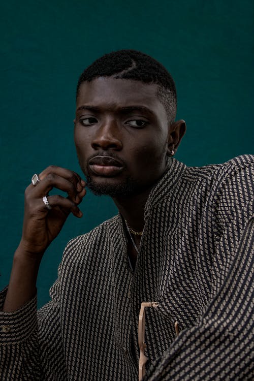 Man Wearing a Button-Down Shirt Posing