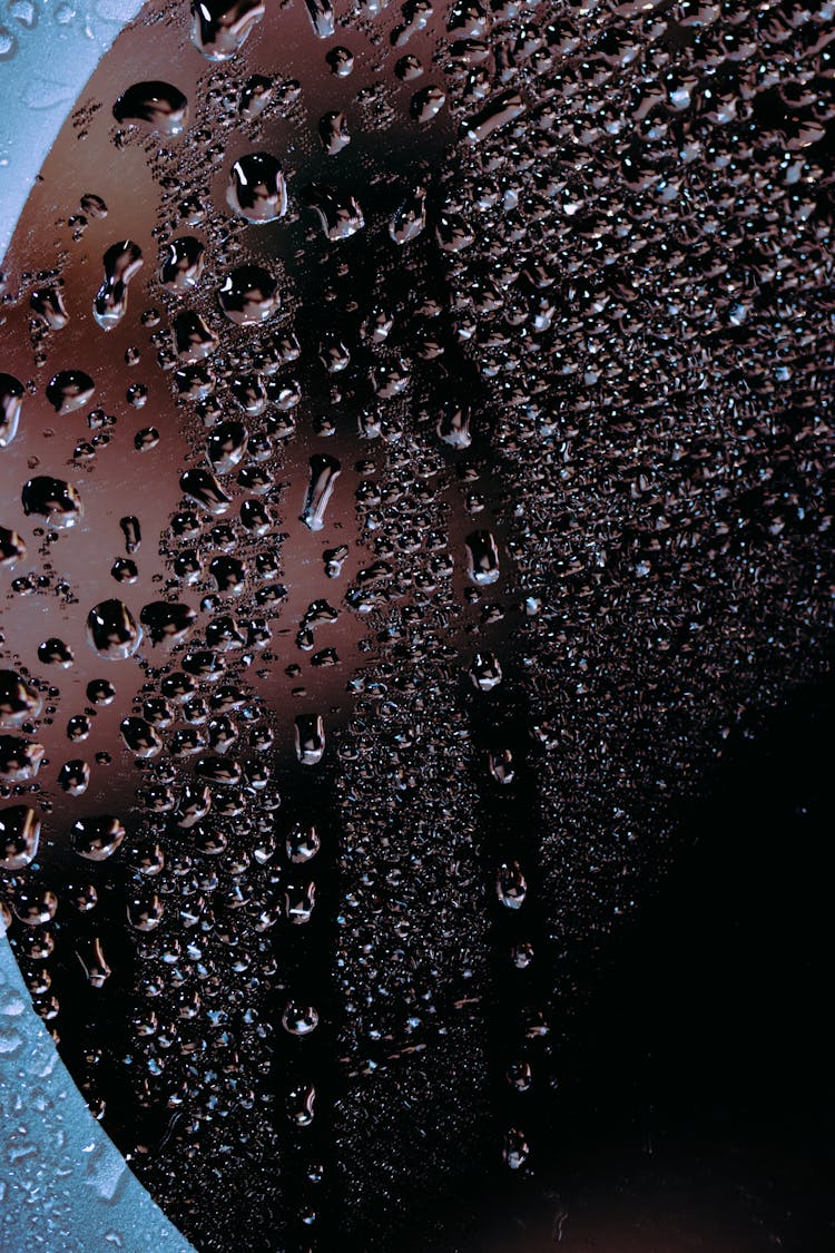 Abstract Background Of Glass With Water Drops