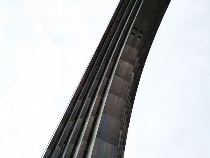 Visitors at a monumental waterfront arch, Bogdan Krupin on Pexels
