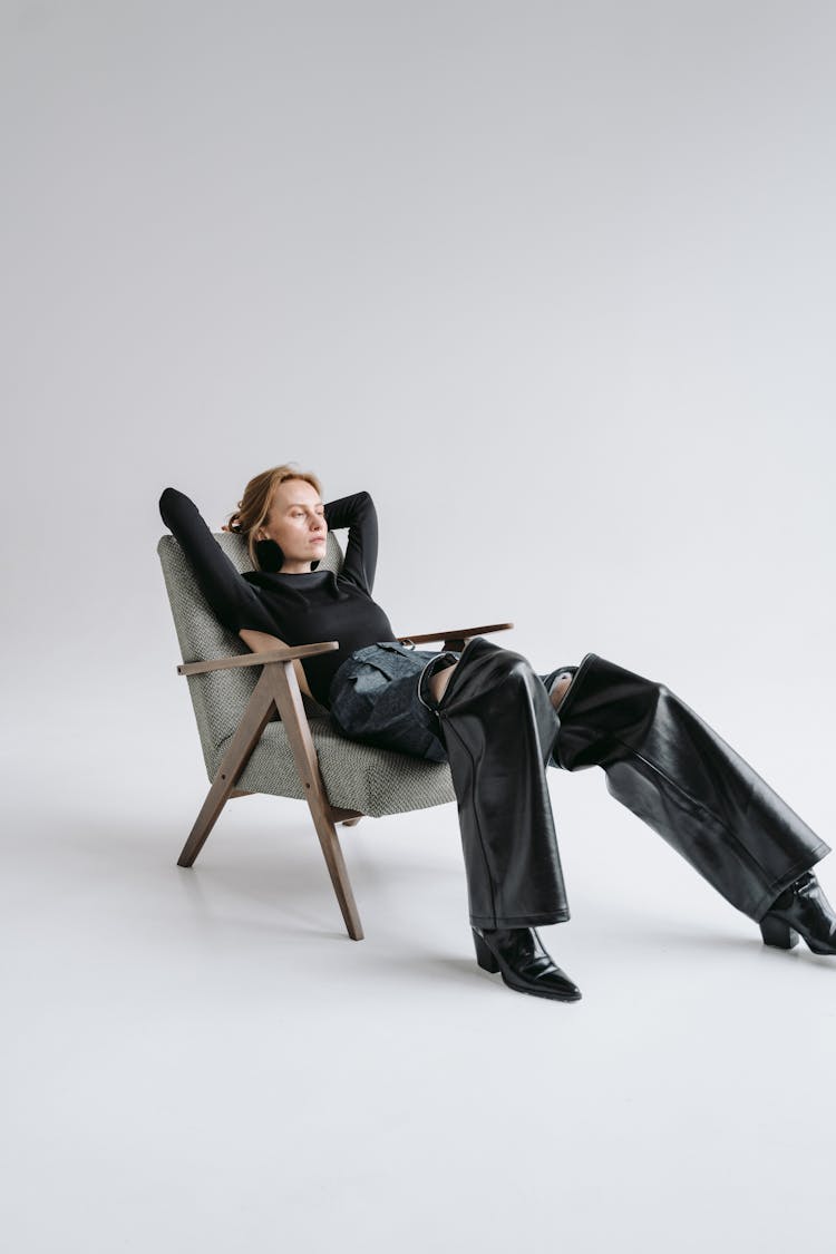 Woman Reclining On A Chair