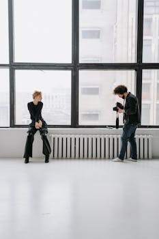 Photographer capturing a model in a bright, modern workspace. Ideal for business and creative themes.