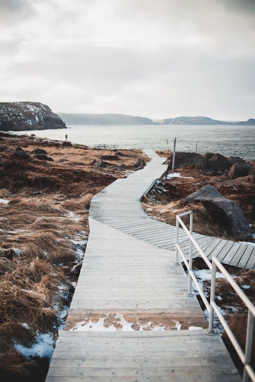 Free Wooden walkway leading to sea Stock Photo