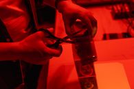 A Person Cutting a Plastic Film