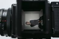 Man in Black Shirt in Black Plastic Container