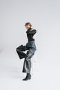A Fashionable Woman Sitting on a Stool