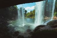 A Waterfall Plunging in a River