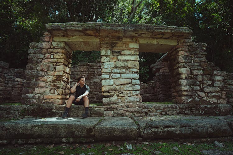 A Man Visiting An Ancient Ruins In The Jungle