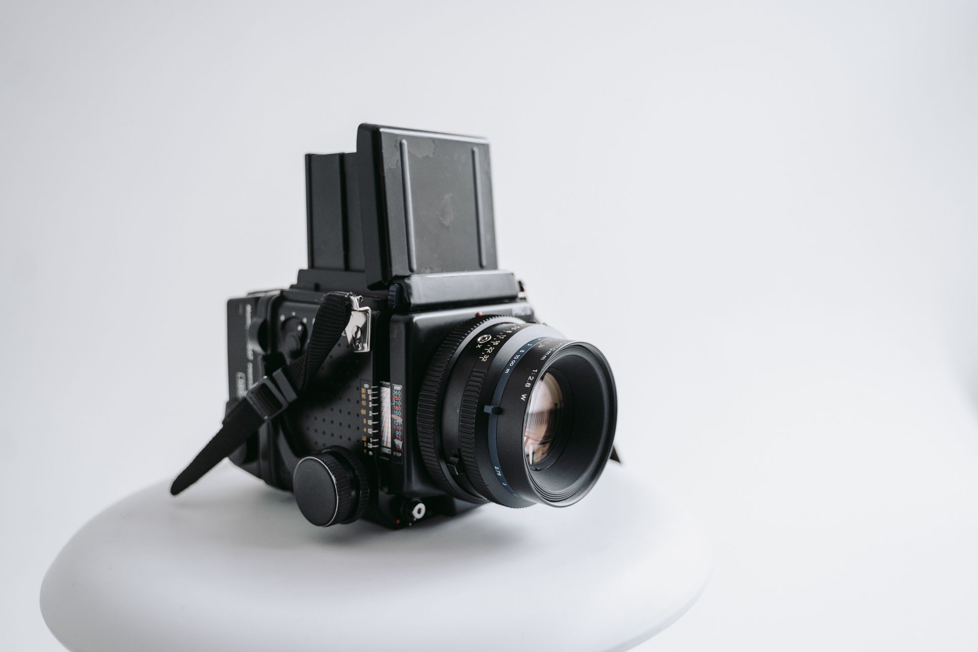 A Medium Format Film Camera on a White Surface