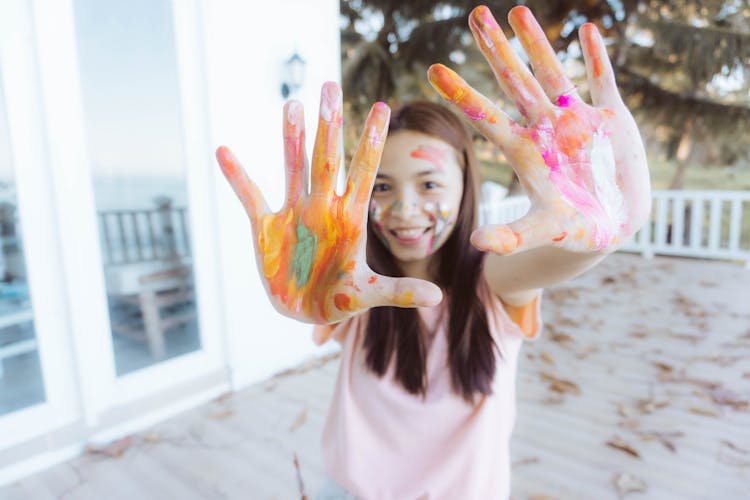 Smiling Girl With Painted Hands