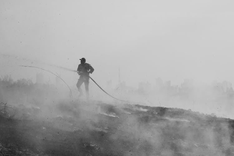 Monochrome Photo Of A Firefighter