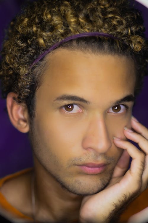 Portrait of Curly Haired Man with Brown Eyes 