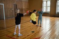 3 Children Playing on Basketball Court