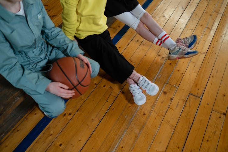 Kids Inside A Gym With A Basketball