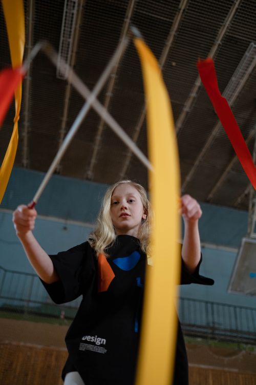 A Girl Holding Gymnastic Ribbons · Free Stock Photo
