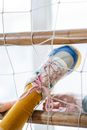 A Person's Feet Stuck on a Net