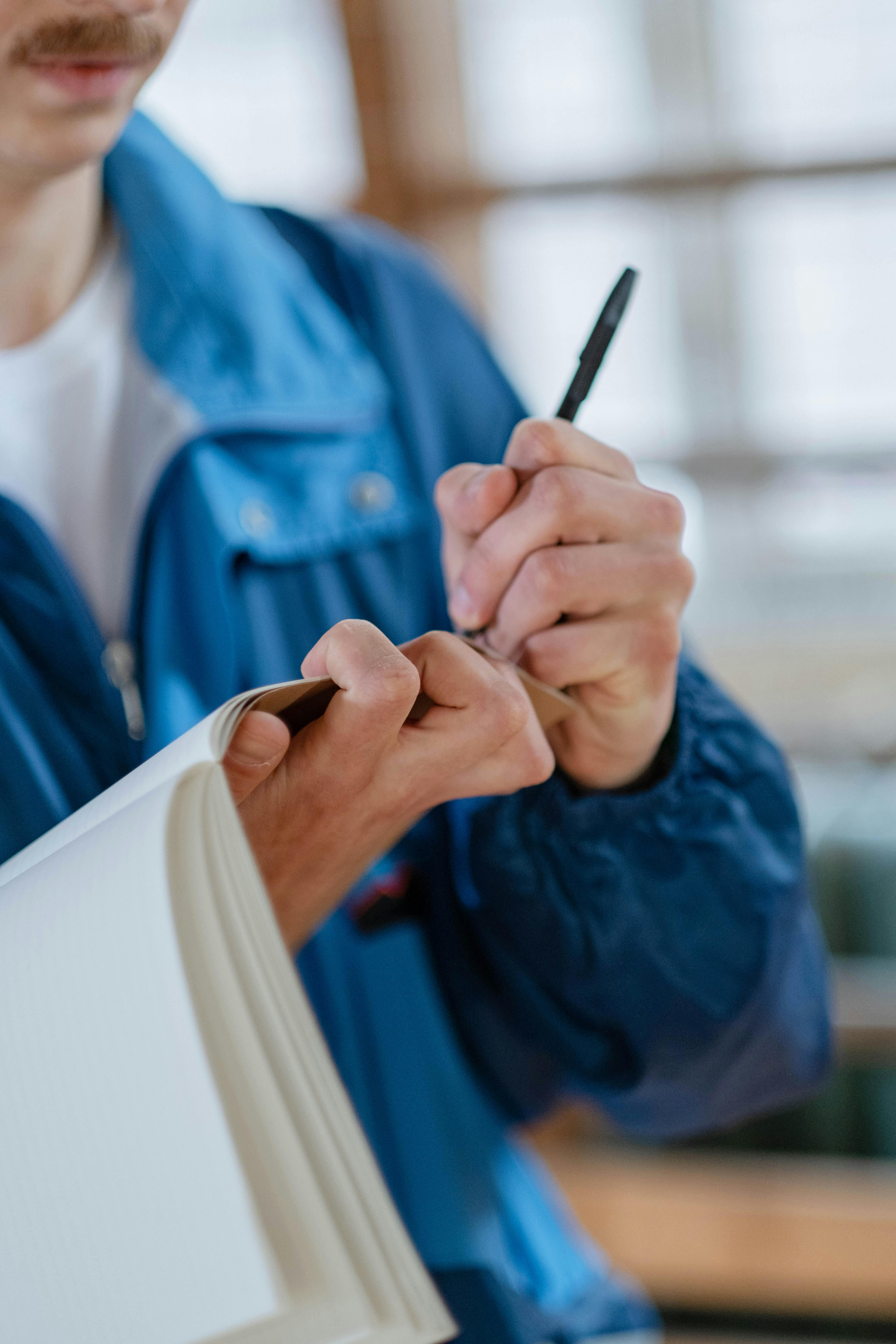 close up shot of a person taking down notes