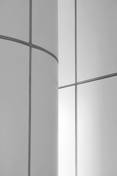 Free Abstract view of a monochrome tiled wall with sleek lines and curves. Stock Photo