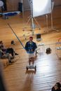 Man in Blue Shirt Sitting on Chair