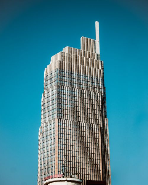 Free A striking modern skyscraper against a clear blue sky in Ho Chi Minh City, Vietnam. Stock Photo