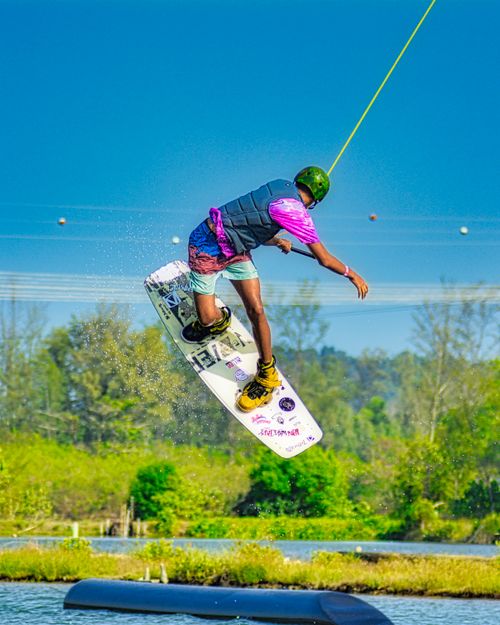 Free Thrilling wakeboarding action captured in stunning detail, set against the vibrant backdrop of Phuket, Thailand. Stock Photo