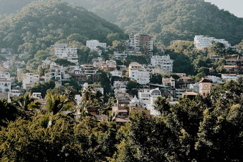 Free White and Brown Buildings on Mountain Stock Photo