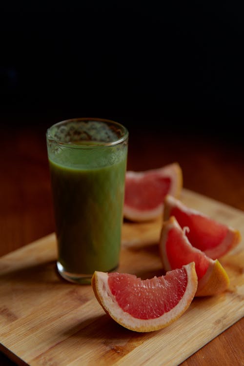 Slices of Citrus Fruit Beside4 a Glass of Drink