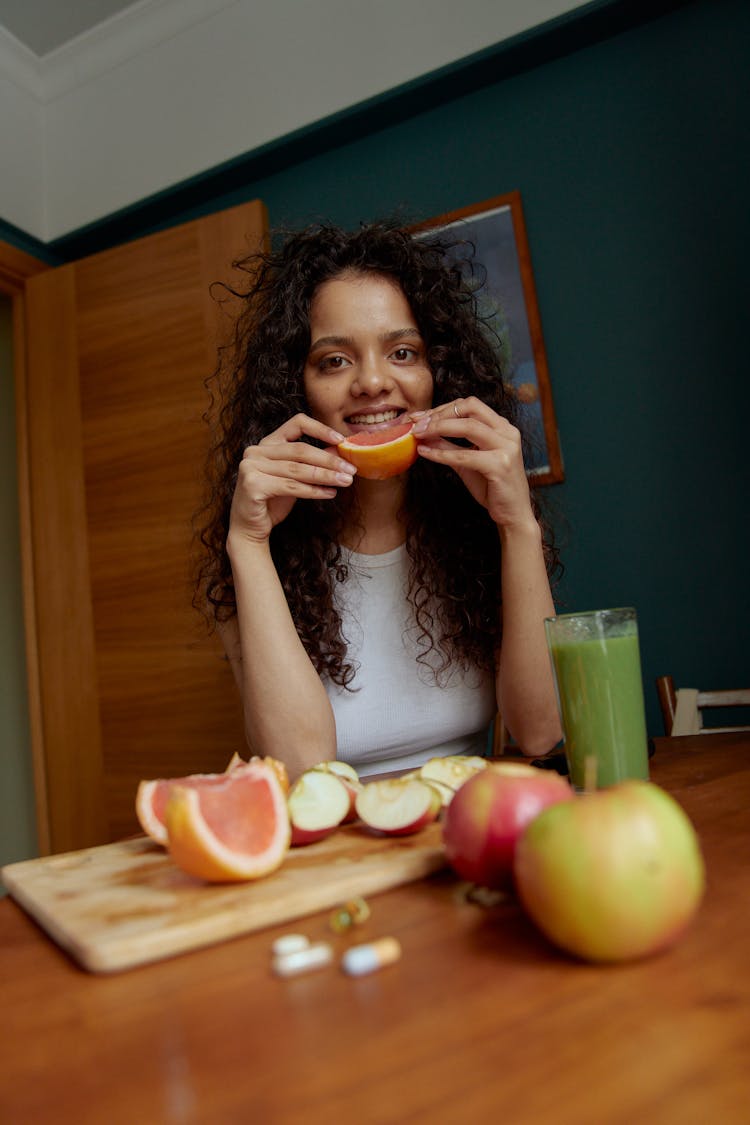 Woman Eating Fruit