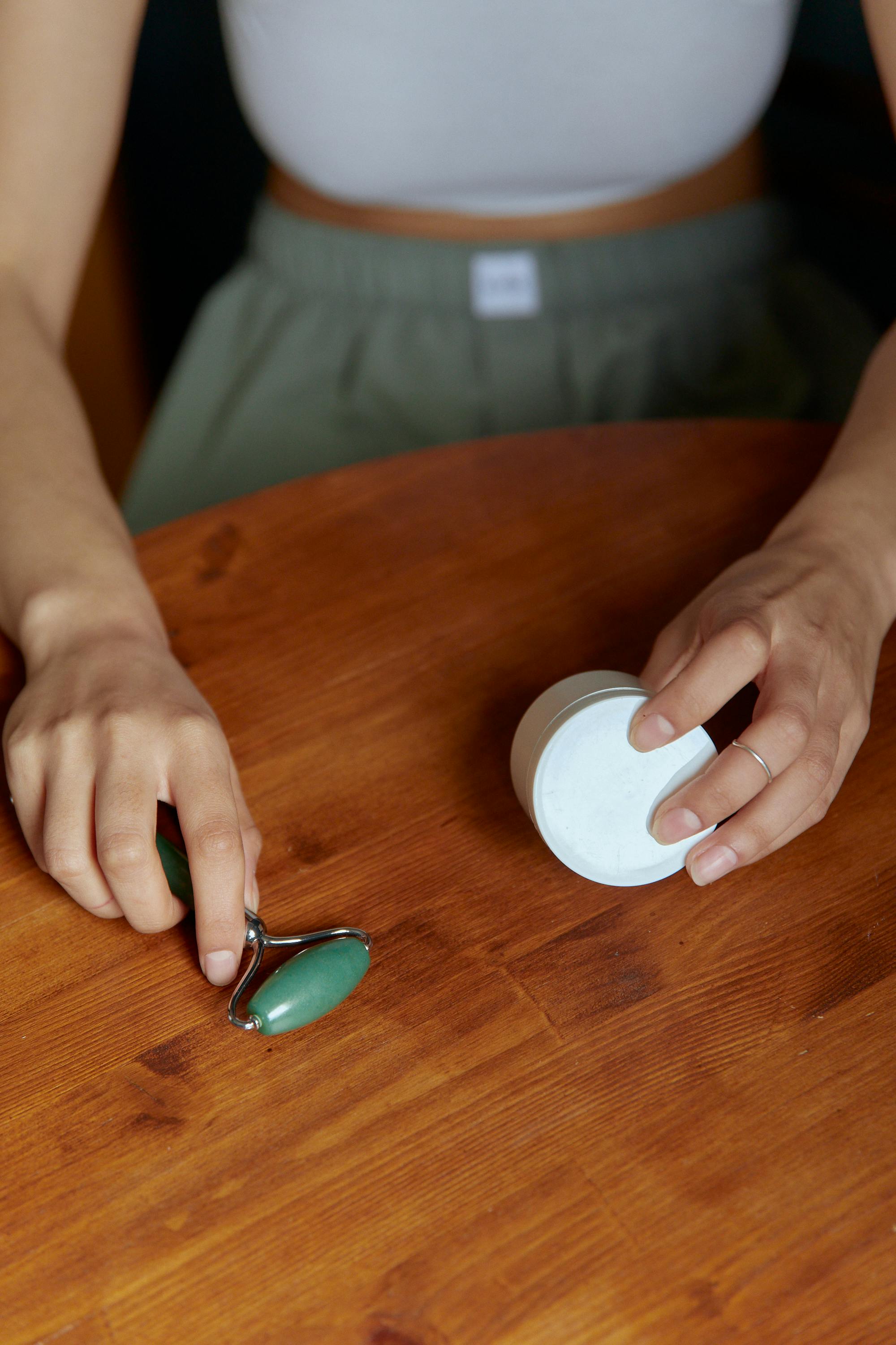 Person Holding White Round Ornament