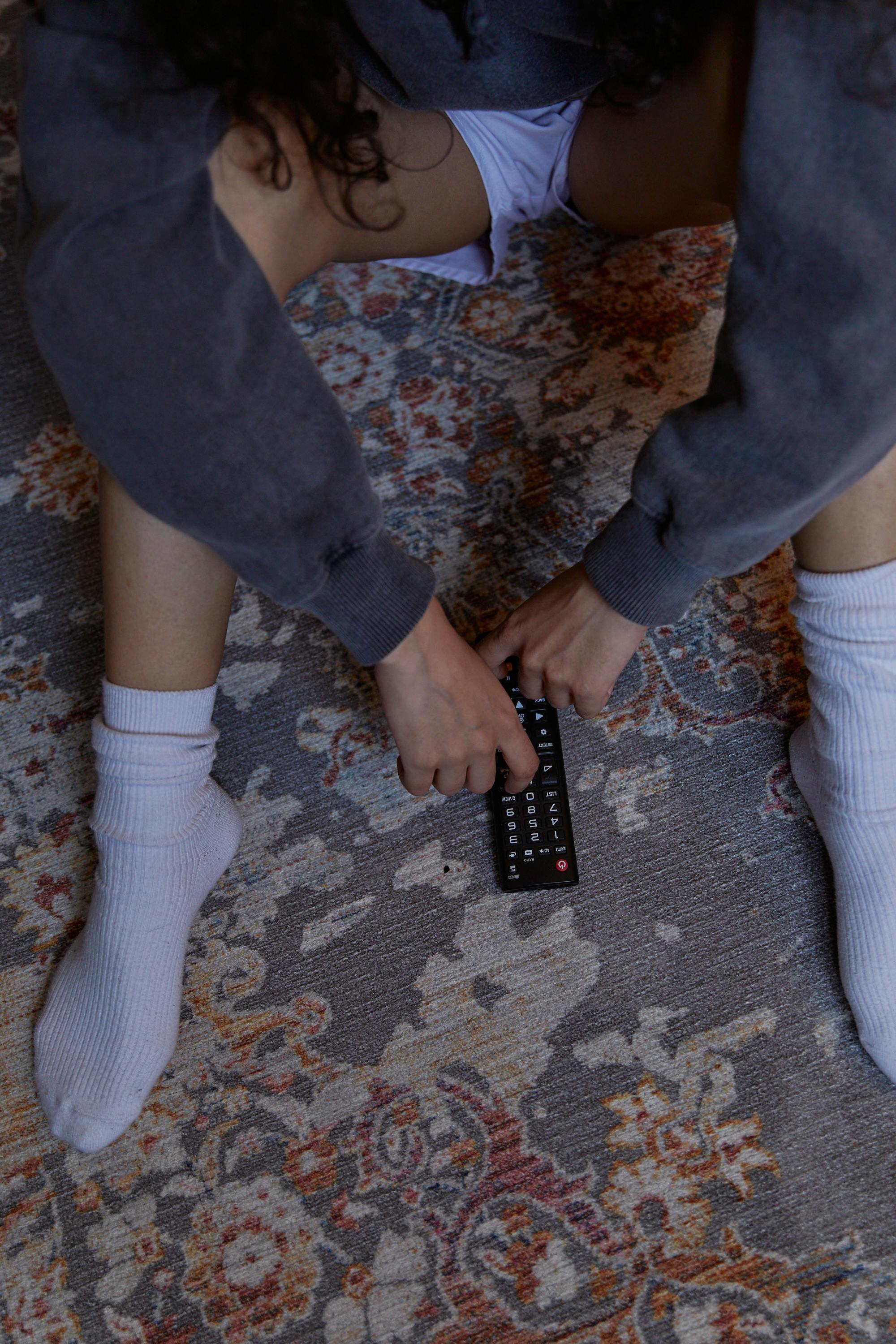 Person in White Socks and Black Pants