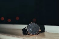 Black Wristwatch on a Table