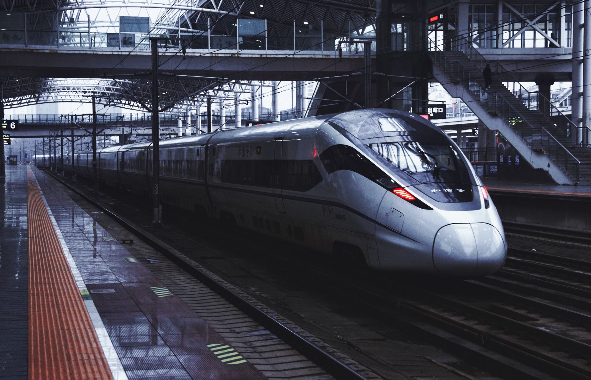 High-speed train at Zhenjiang Railway Station, showcasing modern transportation in China.