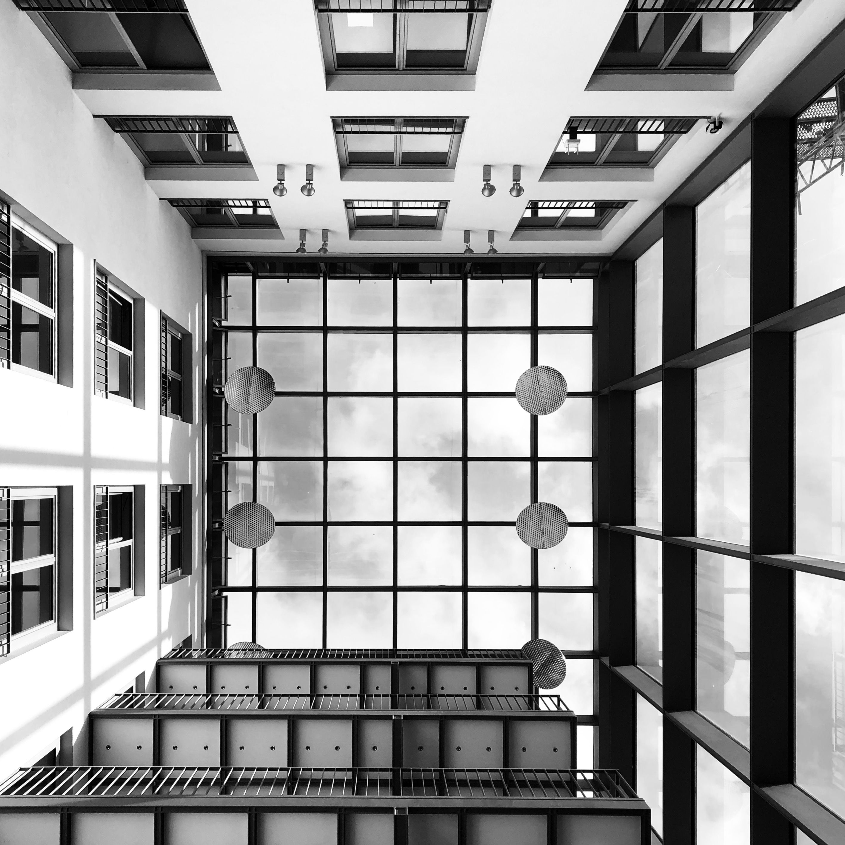 Stunning black-and-white view of a modern atrium ceiling in Berlin, Germany.