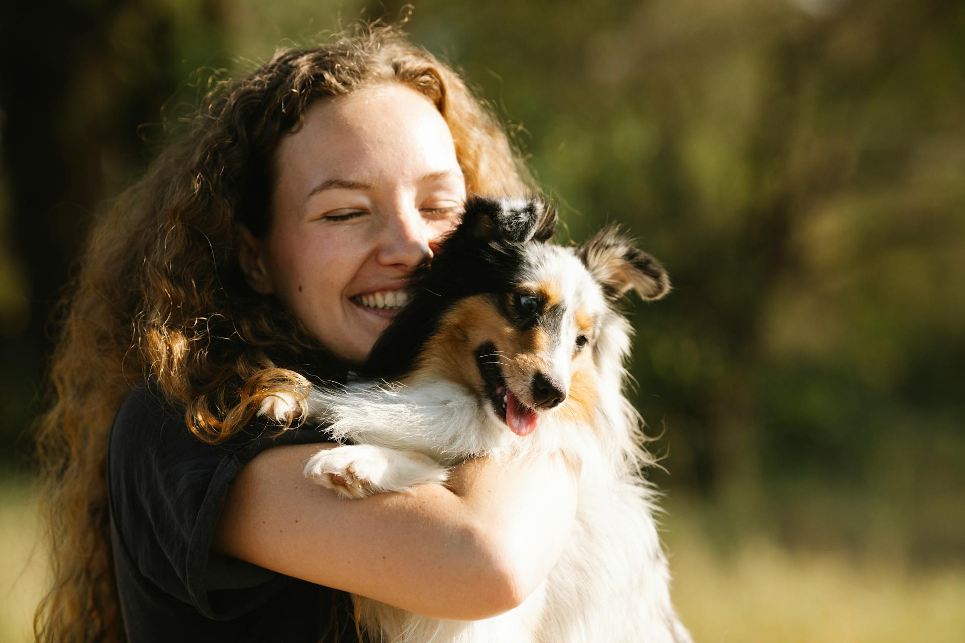 Portrait of a Happy Woman Hugging a Dog