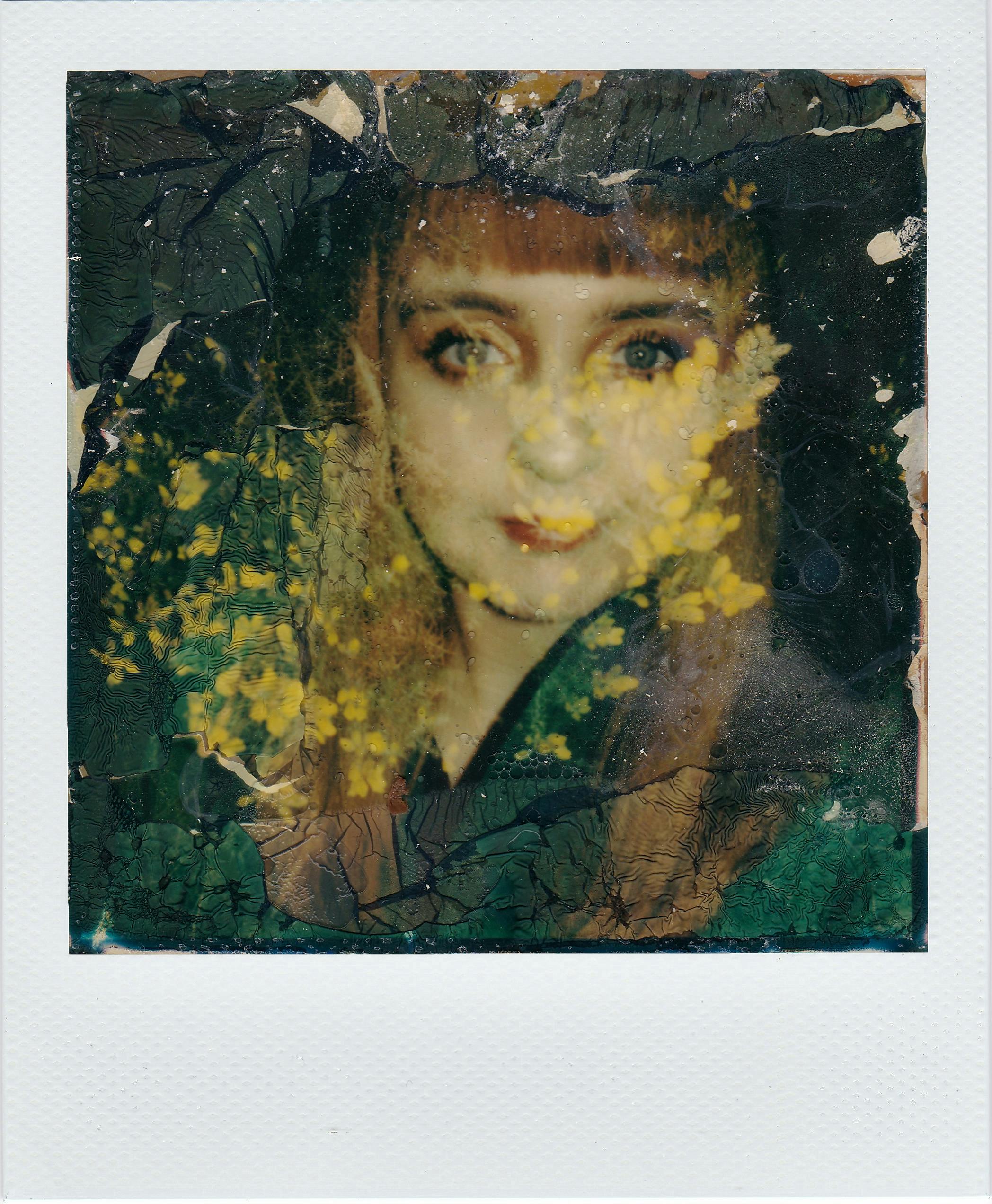 Vintage artistic portrait of a woman with a textured, floral overlay effect.