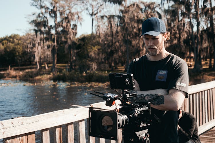 Man In Black Shirt Filming On Set