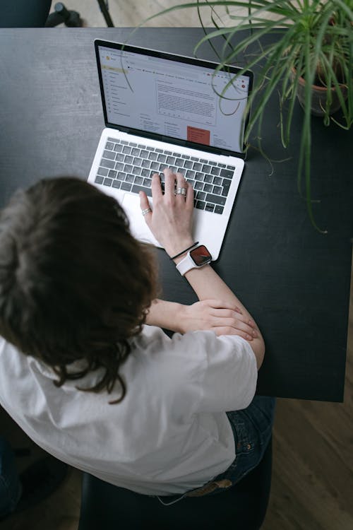Free Person Using a Laptop Stock Photo