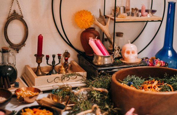 Herbs and magical artifacts arranged at home