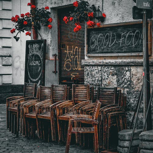 Brown Wooden Chairs on the Street