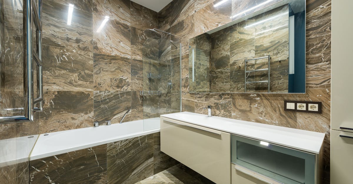 Interior of modern bathroom with marble walls