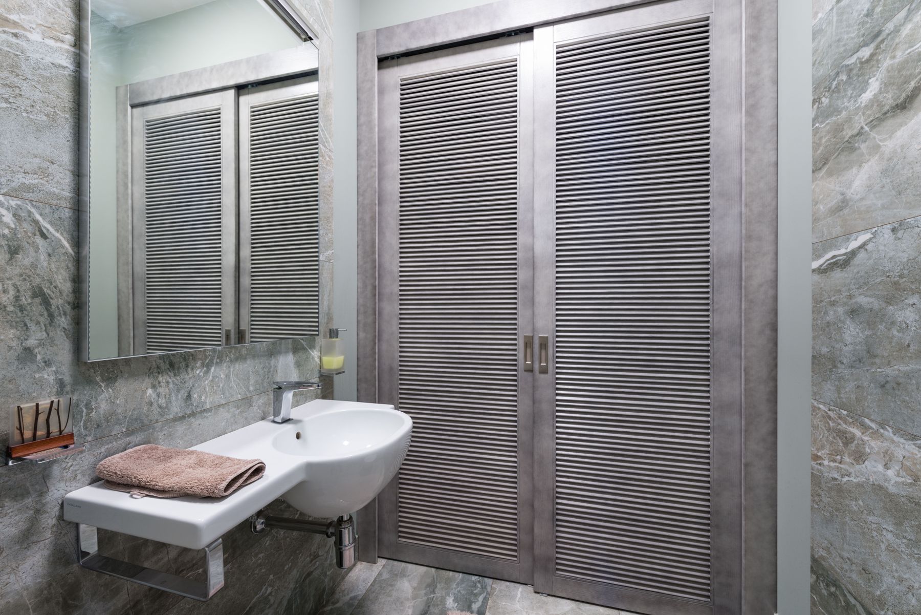 Modern bathroom with sleek sliding doors and contemporary finishes